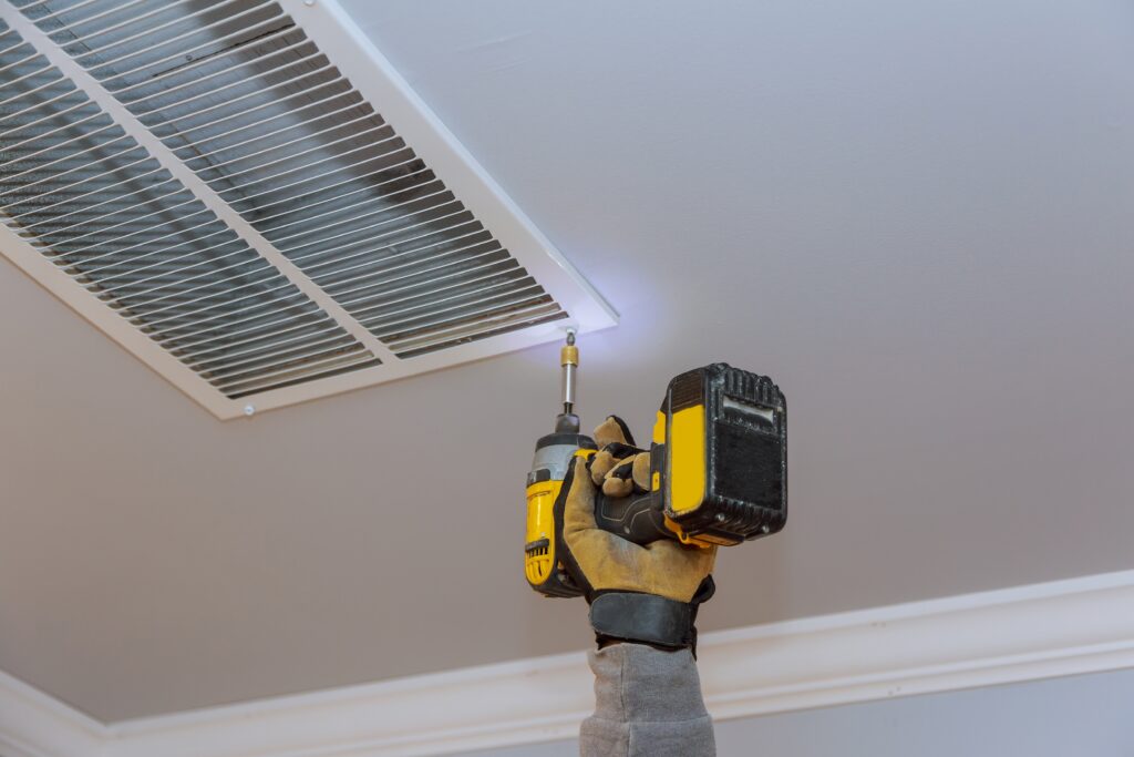 man is installing the ceiling vent cover for home 2023 11 27 05 14 31 utc scaled